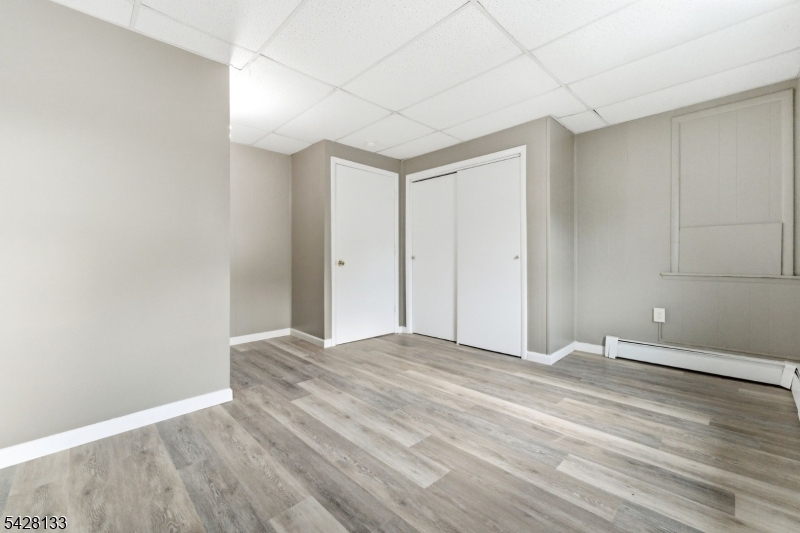 58 Bridge Street Milford, NJ 08848 - Photo 7 of 13 a view of empty room with wooden floor