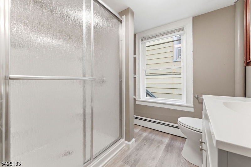 58 Bridge Street Milford, NJ 08848 - Photo 10 of 13 a bathroom with a bathtub and a shower