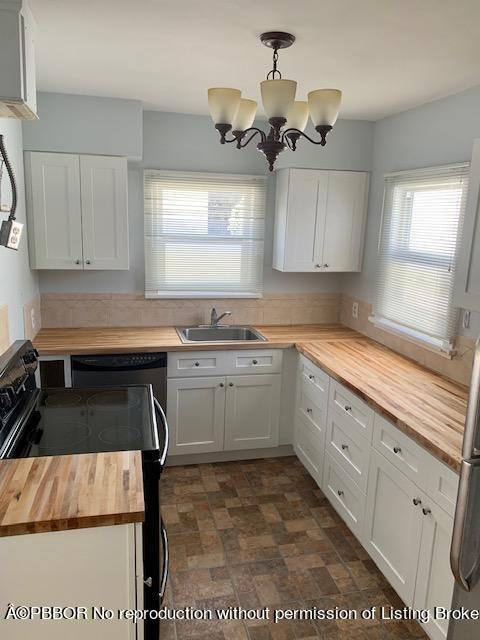 217 Malverne Road West Palm Beach, FL 33405 - Photo 3 of 9 a kitchen with a cabinets and window