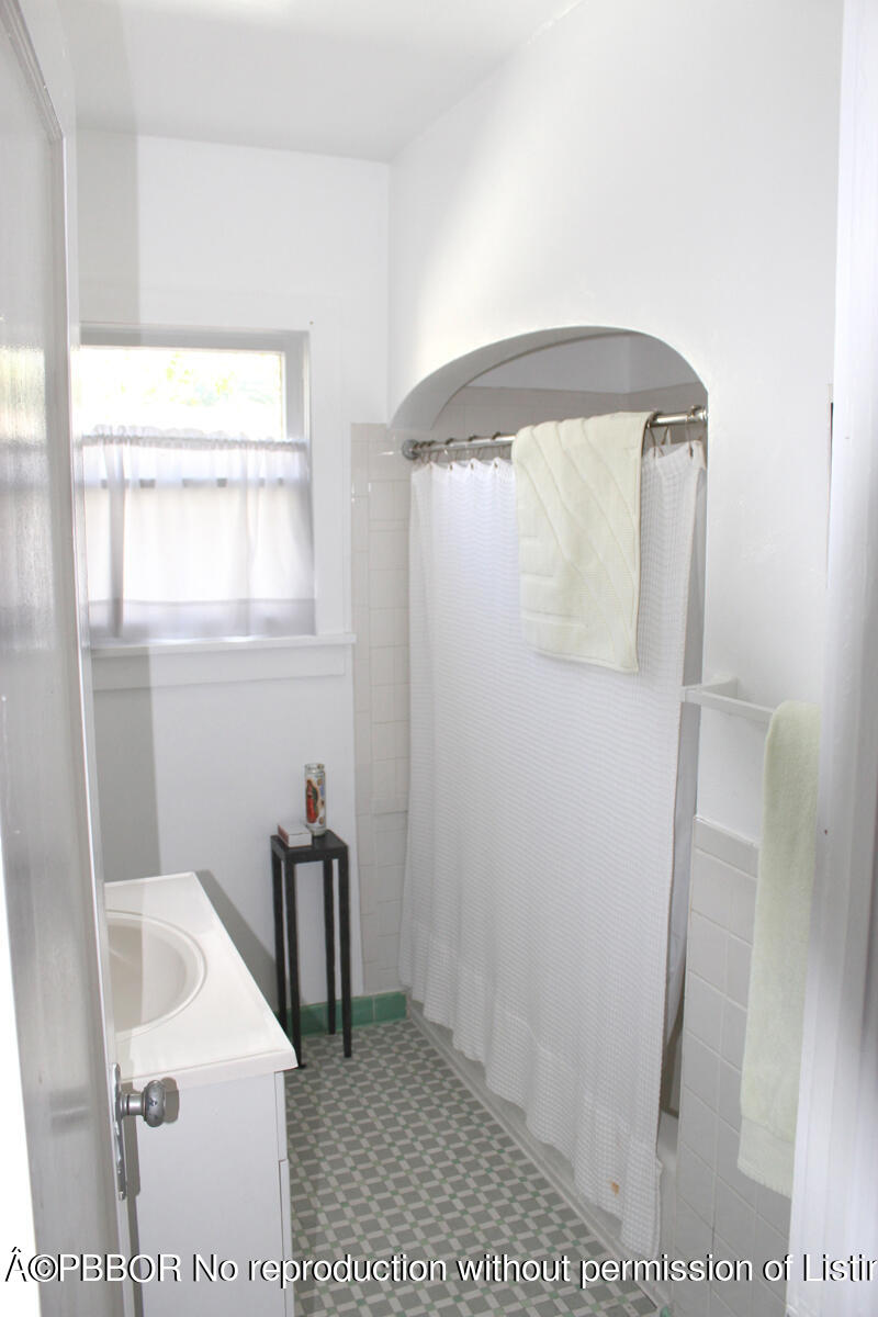217 Malverne Road West Palm Beach, FL 33405 - Photo 9 of 9 a bathroom with a sink and a vanity