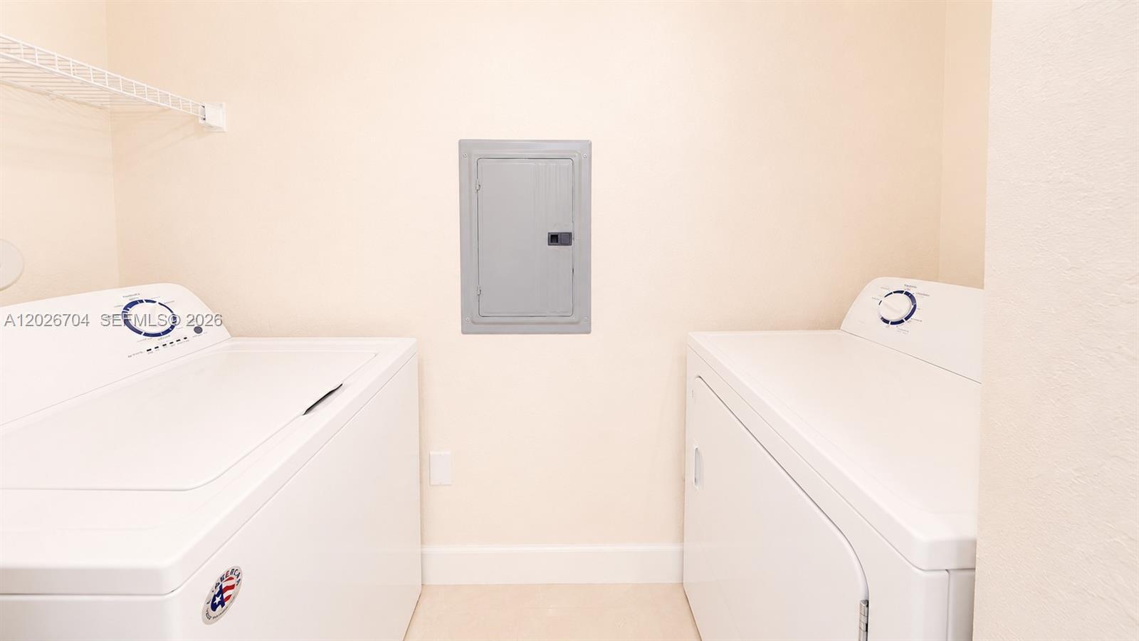 4106 Renaissance Way, Unit 106 Boynton Beach, FL 33426 - Photo 14 of 14 a utility room with dryer and washer