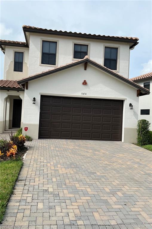 5474 Cassidy Lane Ave Maria, FL 34142 - Photo 1 of 31 a front view of a house with a yard