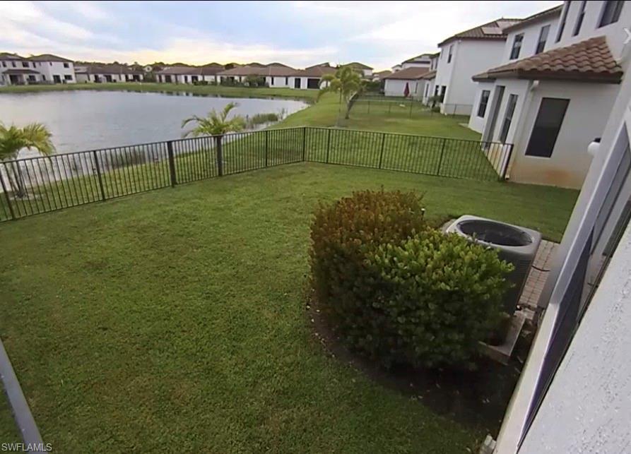5474 Cassidy Lane Ave Maria, FL 34142 - Photo 11 of 31 a view of a lake with a yard from a terrace