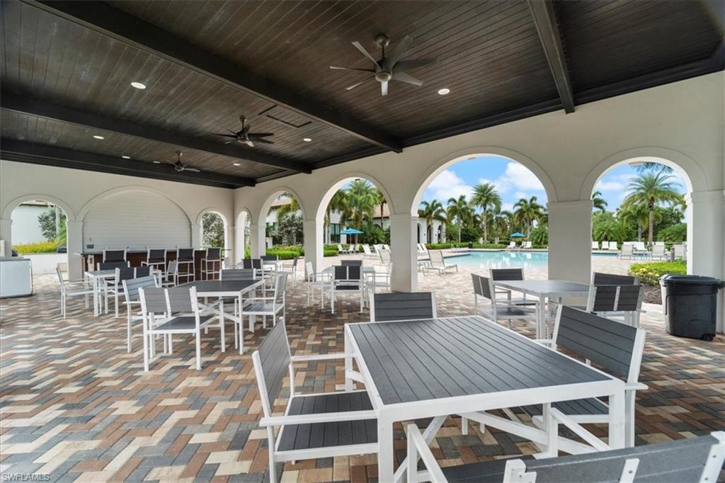 5474 Cassidy Lane Ave Maria, FL 34142 - Photo 21 of 31 a outdoor space with lots of tables a large window and furniture
