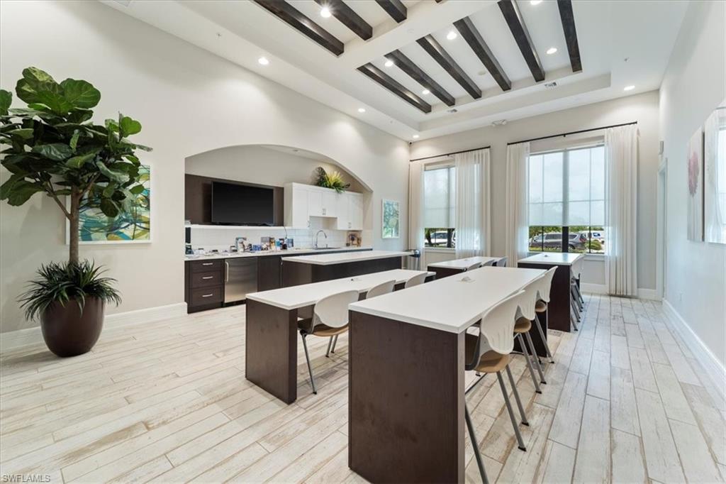 5474 Cassidy Lane Ave Maria, FL 34142 - Photo 29 of 31 a kitchen with a sink appliances and cabinets