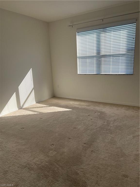 5474 Cassidy Lane Ave Maria, FL 34142 - Photo 10 of 31 a view of an empty room with a window