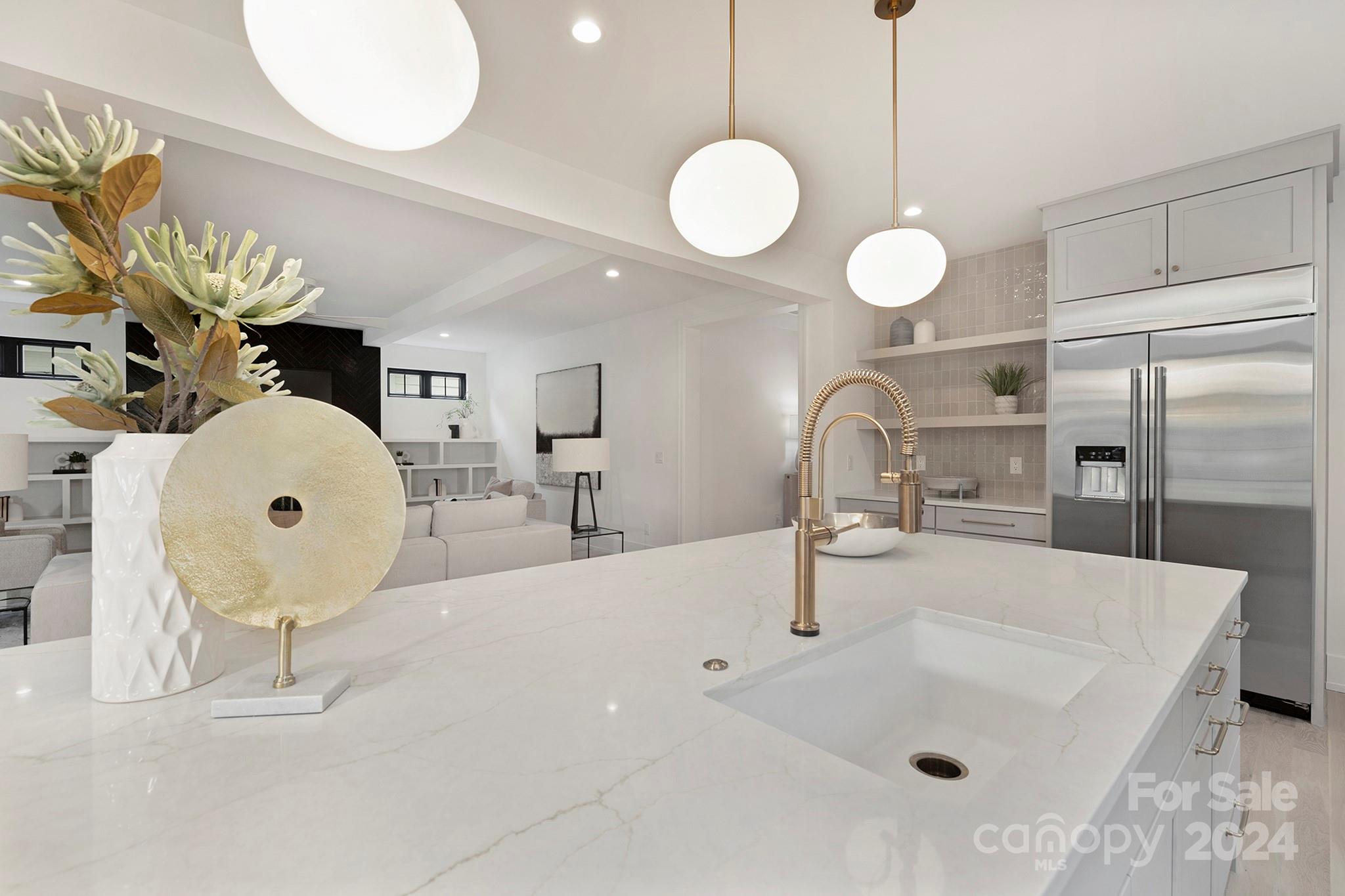 1815 Club Road Charlotte, NC 28205 - Photo 16 of 42 a kitchen with a sink a counter and chairs