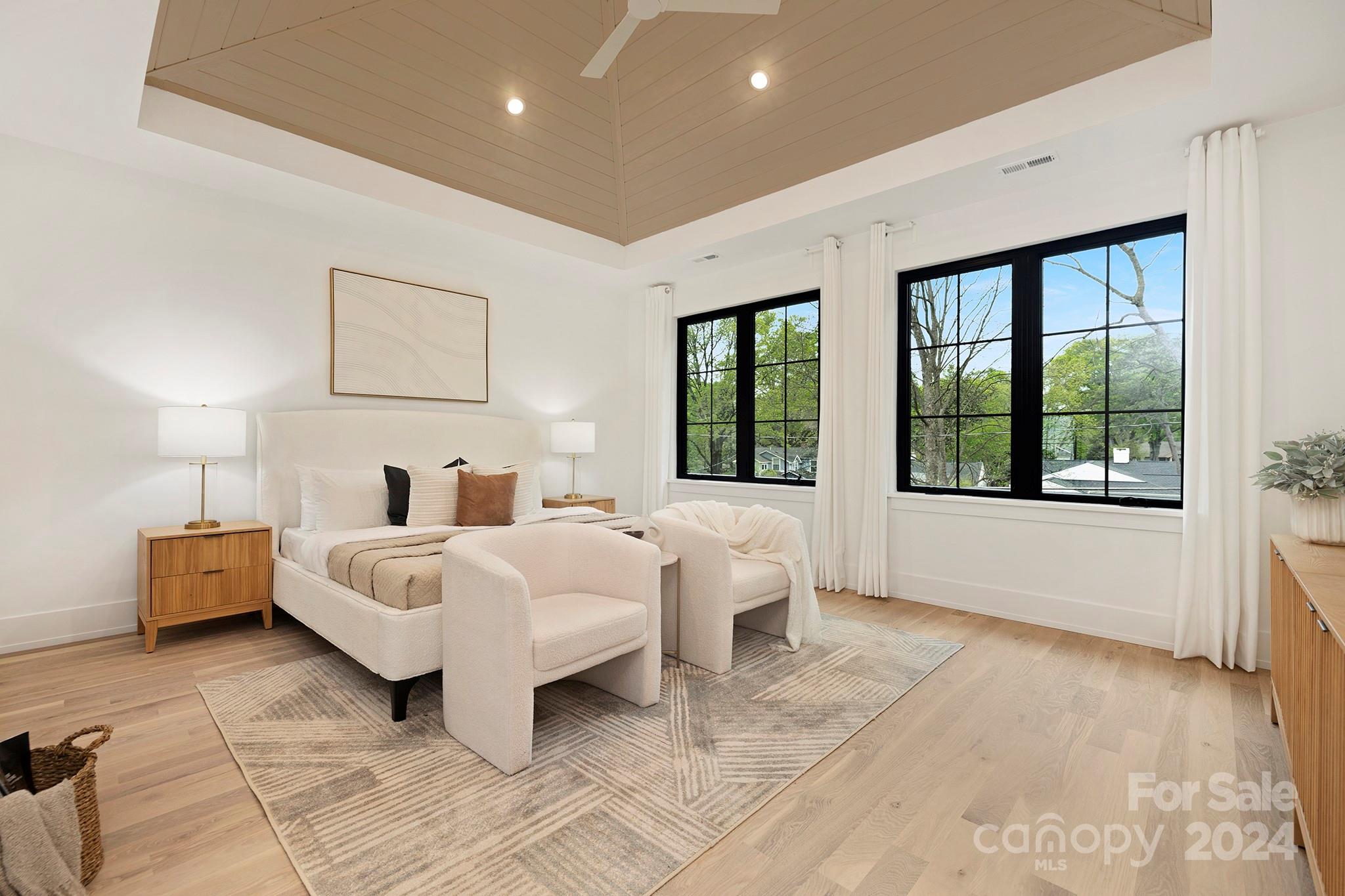 1815 Club Road Charlotte, NC 28205 - Photo 23 of 42 a bed room with a bed and a large window