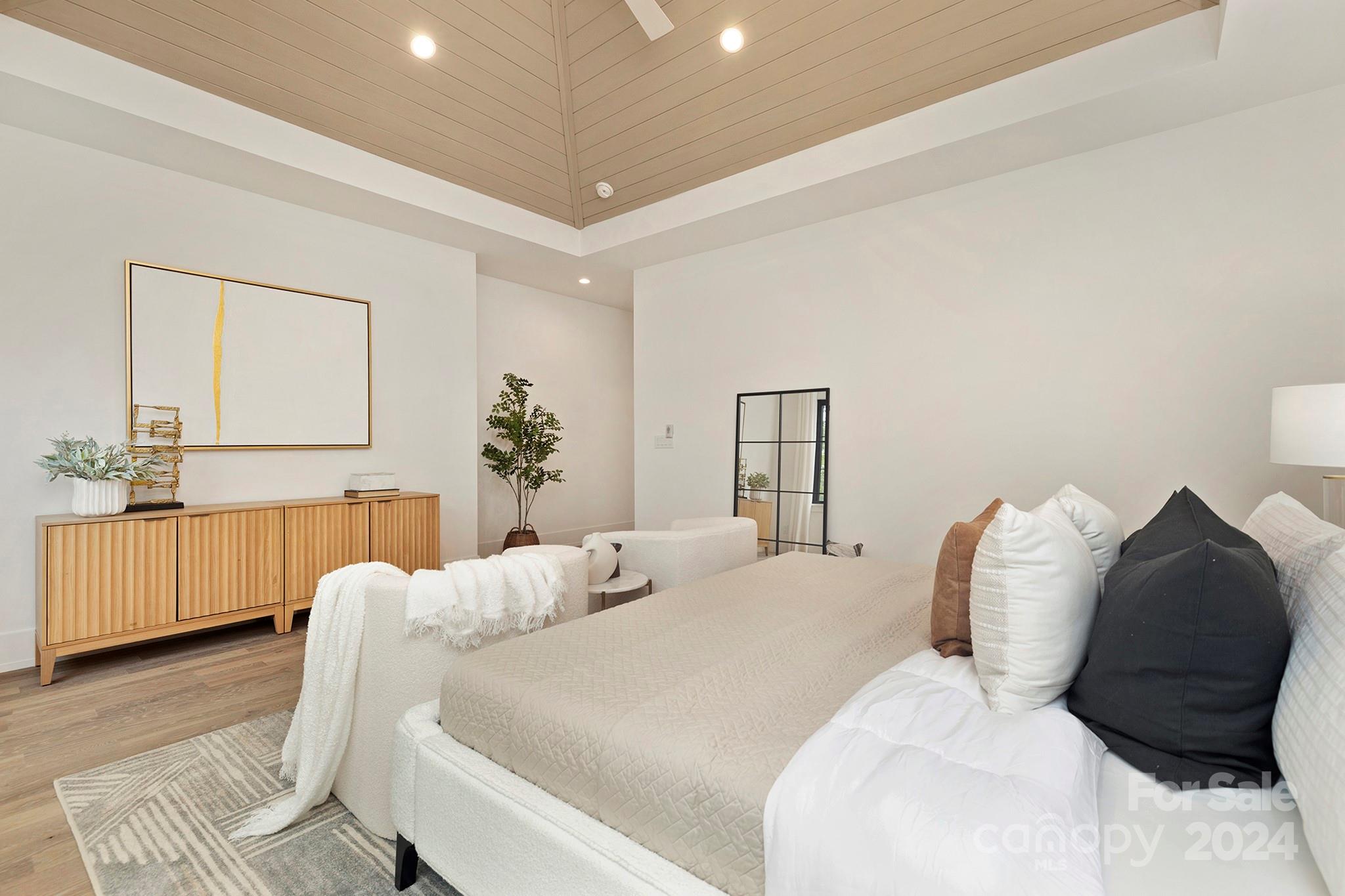 1815 Club Road Charlotte, NC 28205 - Photo 25 of 42 a bedroom with a bed and a dresser