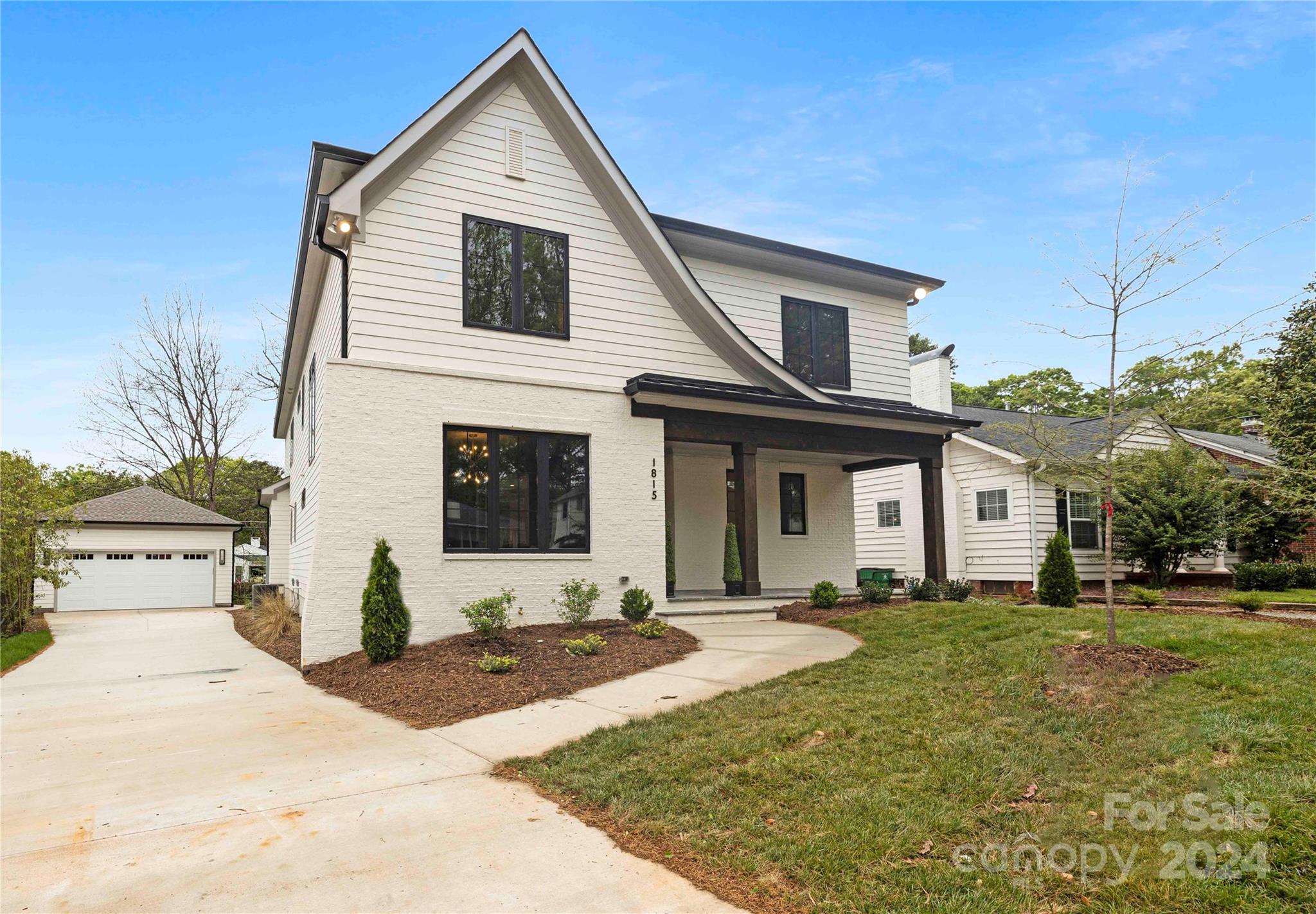 1815 Club Road Charlotte, NC 28205 - Photo 3 of 42 a front view of a house with a yard