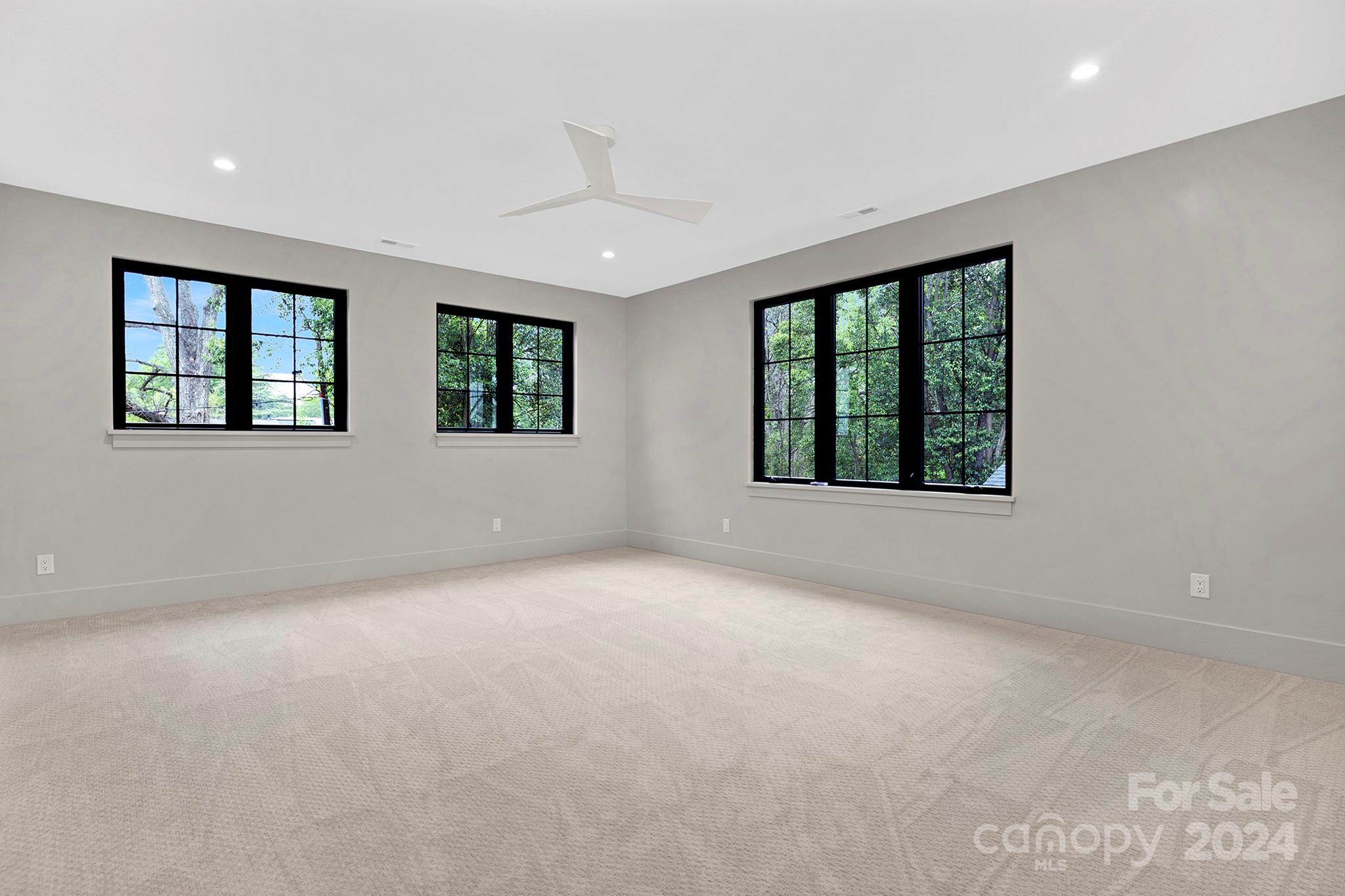 1815 Club Road Charlotte, NC 28205 - Photo 31 of 42 an empty room with windows