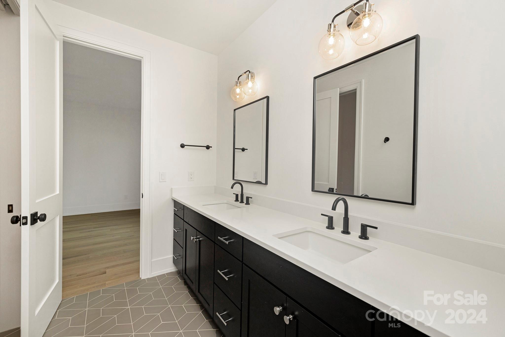 1815 Club Road Charlotte, NC 28205 - Photo 36 of 42 a bathroom with a double vanity sink mirror and