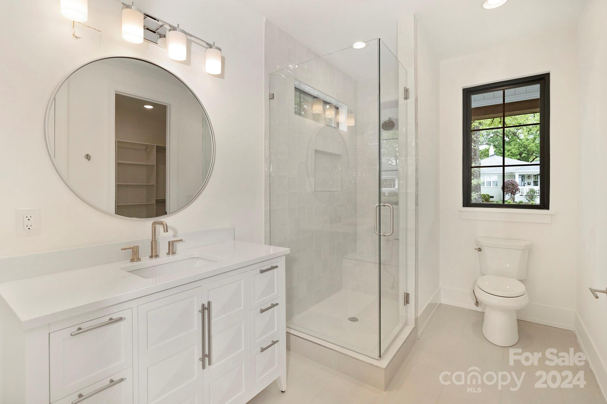 1815 Club Road Charlotte, NC 28205 - Photo 38 of 42 a bathroom with a toilet sink and mirror