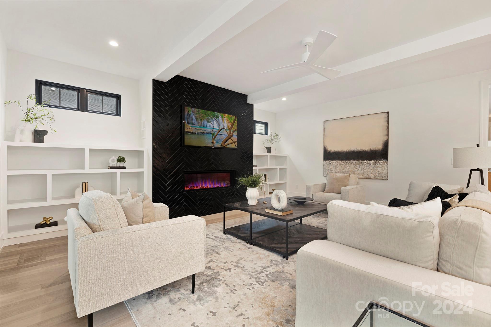 1815 Club Road Charlotte, NC 28205 - Photo 6 of 42 a living room with furniture a flat screen tv and a fireplace