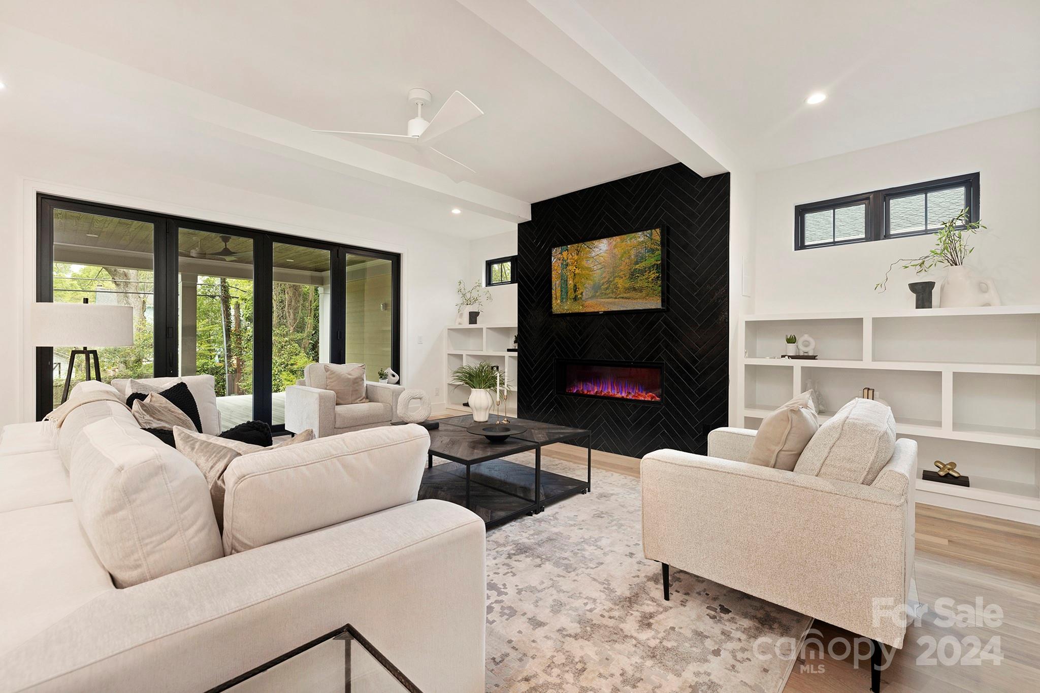 1815 Club Road Charlotte, NC 28205 - Photo 8 of 42 a living room with furniture and a flat screen tv
