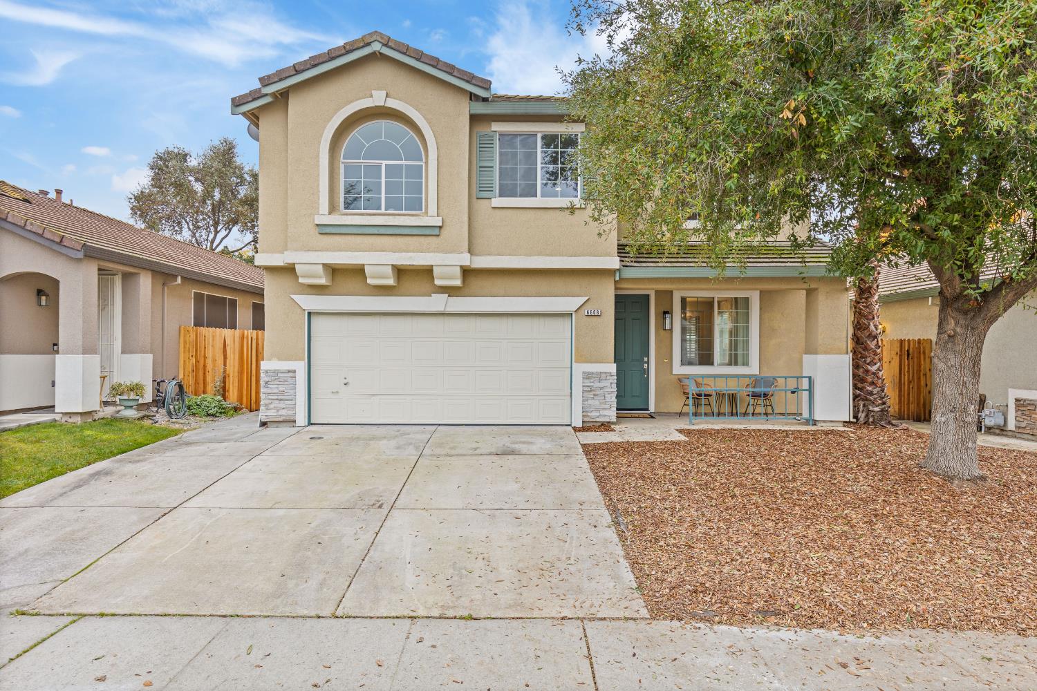 6608 Trailride Way Citrus Heights, CA 95621 - Photo 1 of 1 a front view of a house with a yard and garage