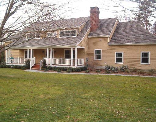 a front view of house with yard and seating area