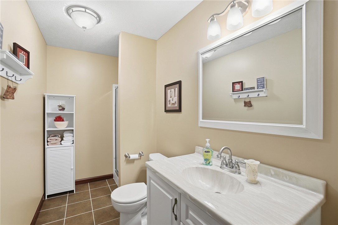 710 Governors Road Troy, OH 45373 - Photo 42 of 56 This clean and inviting bathroom features ample vanity space and a convenient walk-in shower.