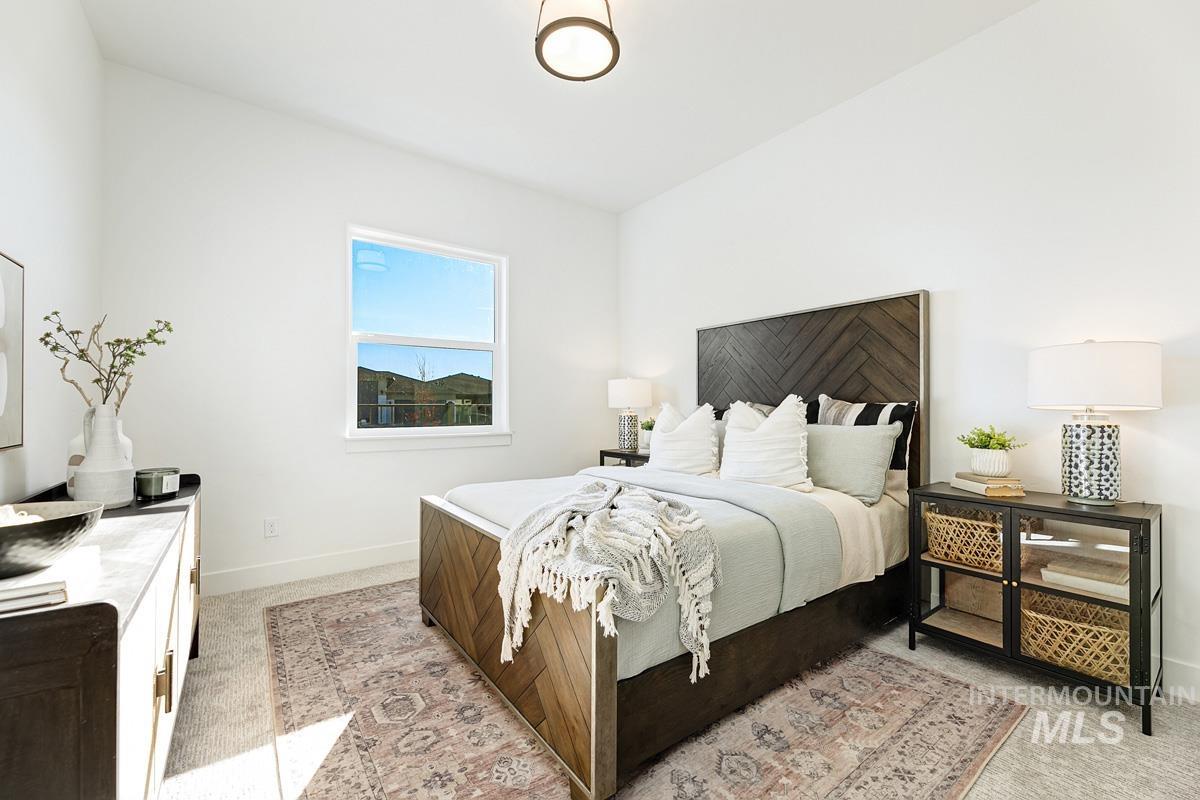 21895 Paint Avenue Star, ID 83669 - Photo 19 of 35 Bedroom with light carpet and baseboards