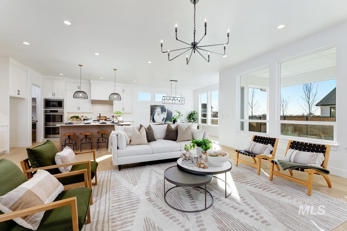 21895 Paint Avenue Star, ID 83669 - Photo 6 of 35 Living room featuring light wood-style flooring, recessed lighting, and a chandelier