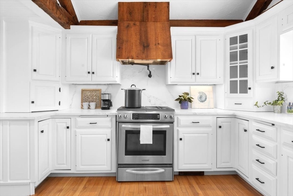 76 Macombers Way Marshfield, MA 02050 - Photo 14 of 41 a kitchen with white cabinets and white appliances