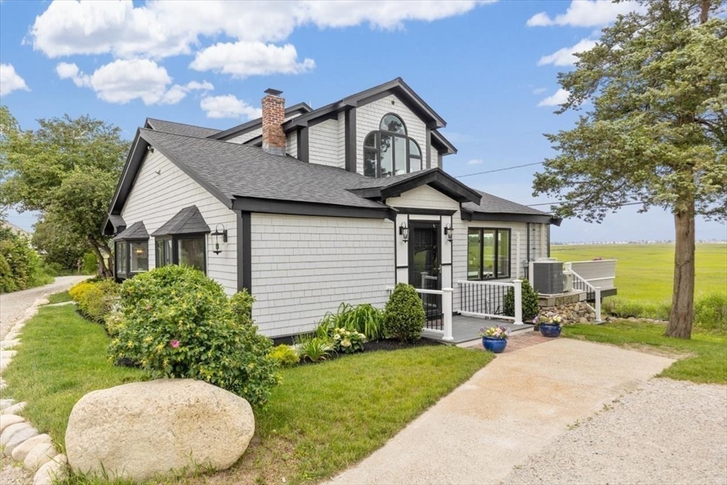 76 Macombers Way Marshfield, MA 02050 - Photo 2 of 41 a front view of a house with a yard and garage