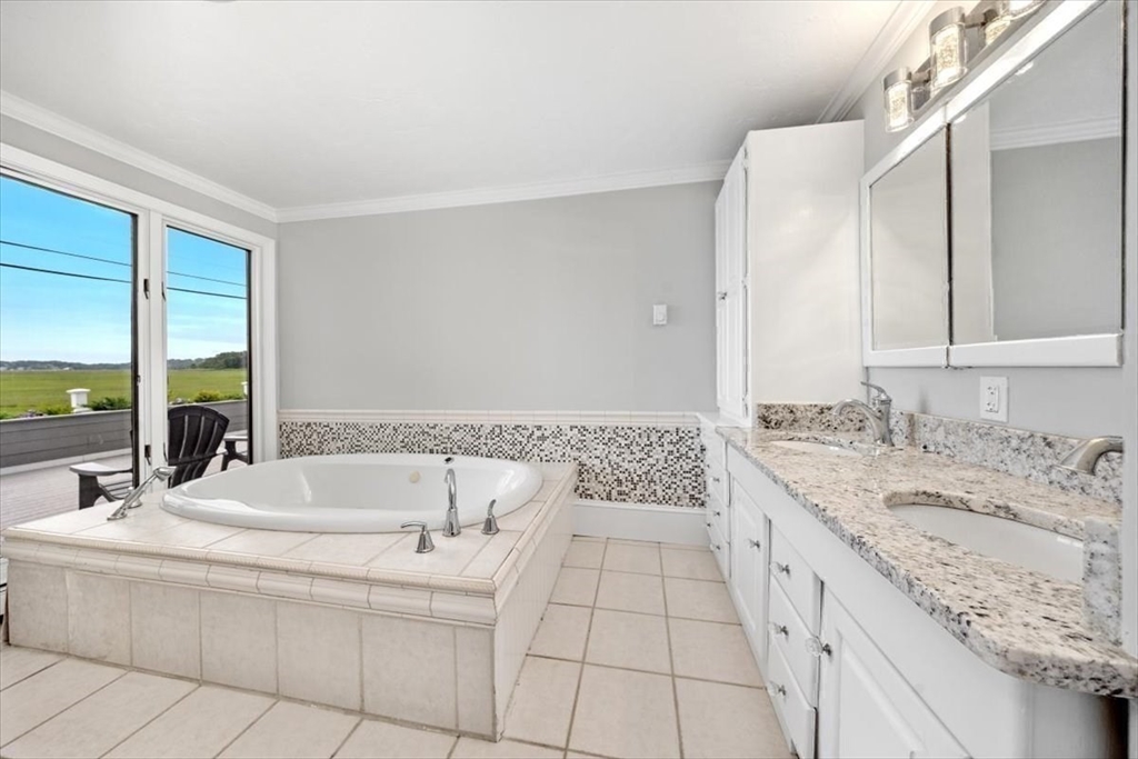 76 Macombers Way Marshfield, MA 02050 - Photo 21 of 41 a spacious bathroom with a bathtub and a sink