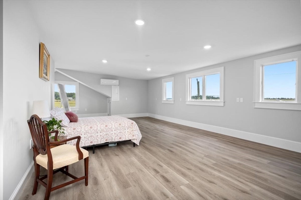 76 Macombers Way Marshfield, MA 02050 - Photo 32 of 41 a bedroom with furniture and a wooden floor
