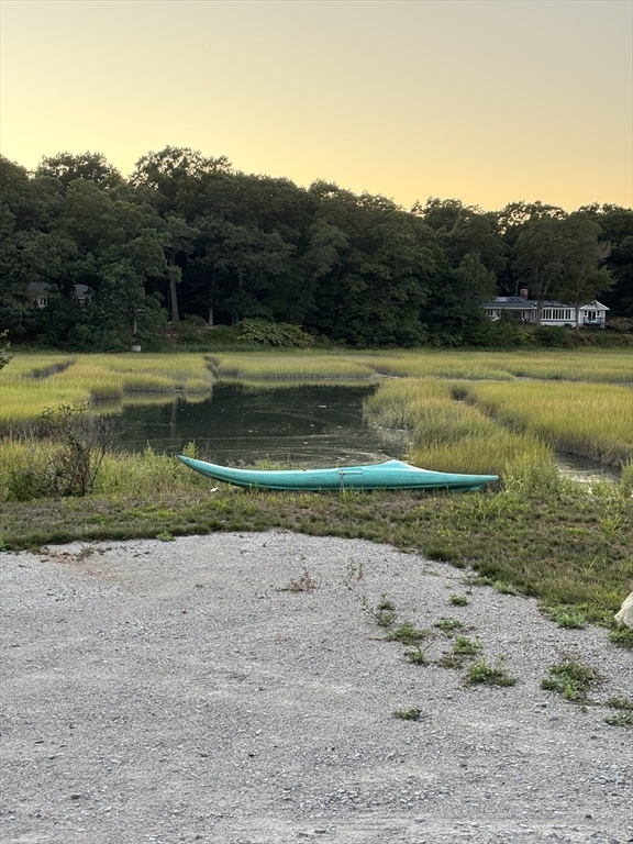 76 Macombers Way Marshfield, MA 02050 - Photo 38 of 41 a view of a lake with a mountain in the background