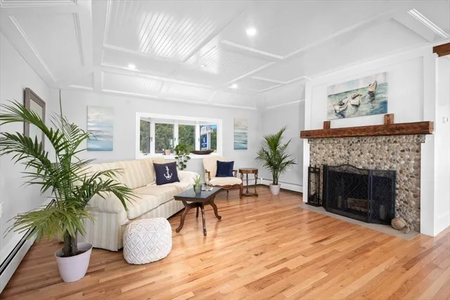 a view of a dining room with furniture wooden floor and chandelier