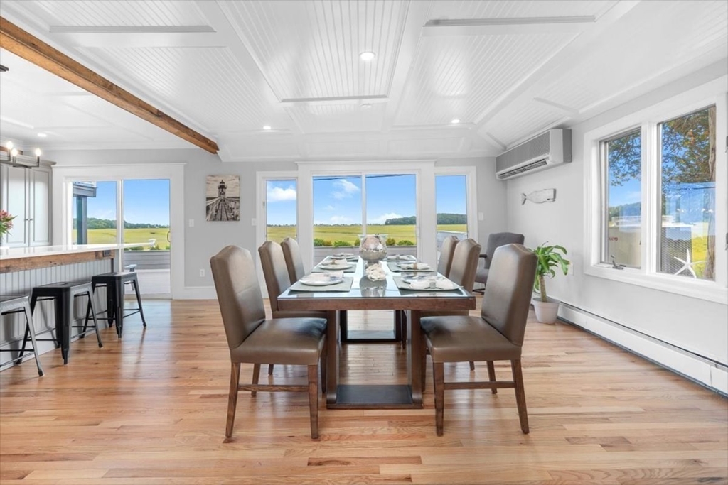 76 Macombers Way Marshfield, MA 02050 - Photo 8 of 41 a view of a dining room with furniture window and wooden floor