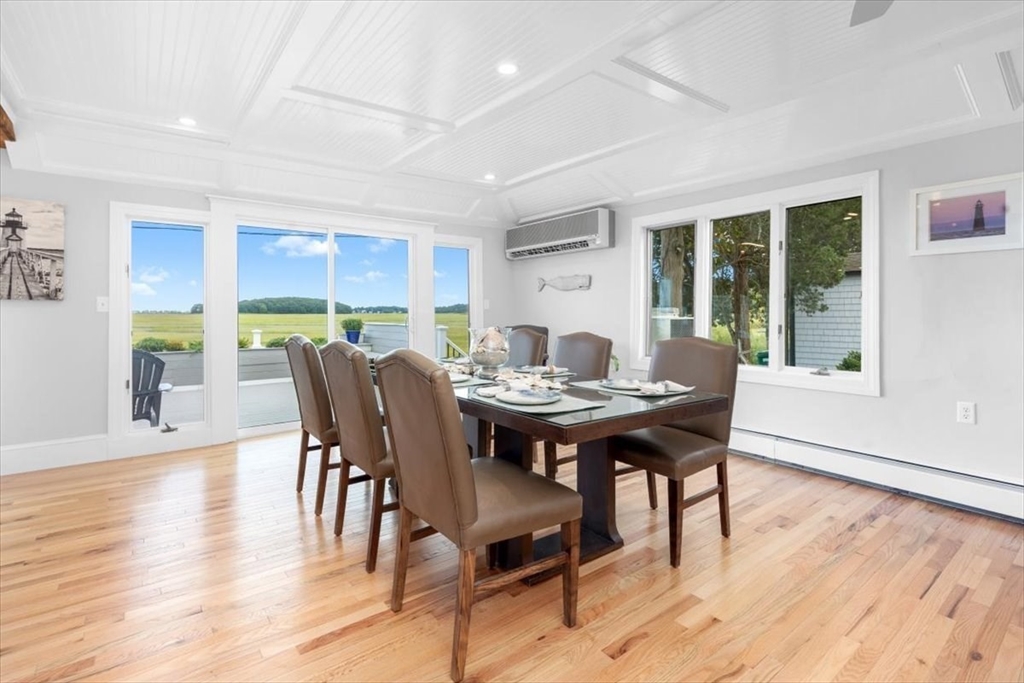 76 Macombers Way Marshfield, MA 02050 - Photo 9 of 41 a view of a dining room with furniture window and wooden floor