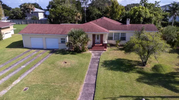 a view of house with garden space and street view