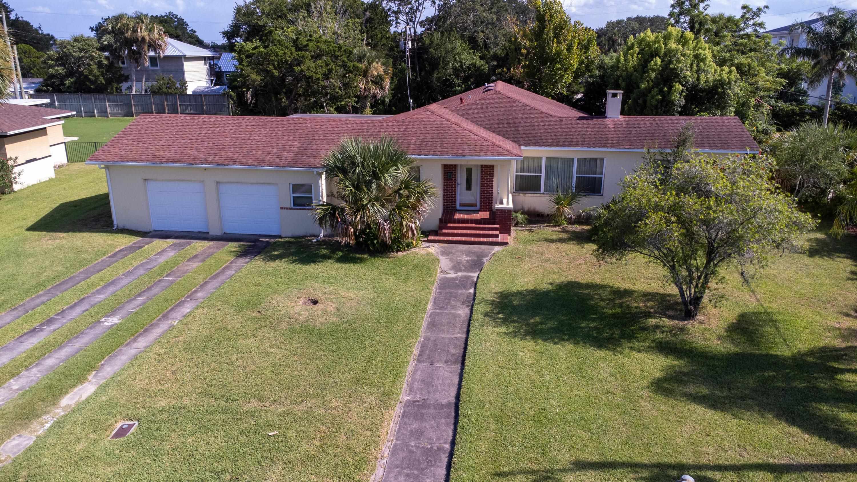 a view of house with garden space and street view