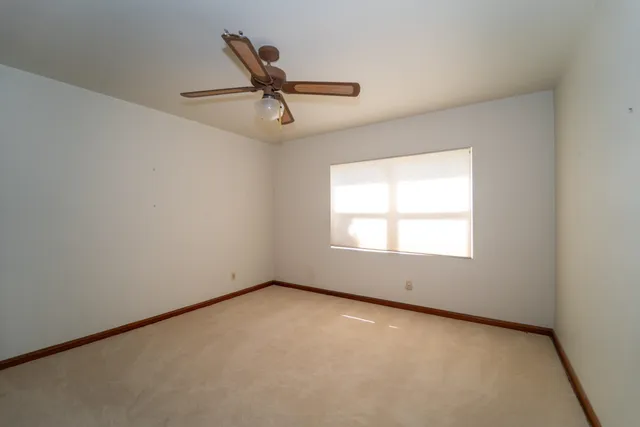 a aerial view of a house with a yard