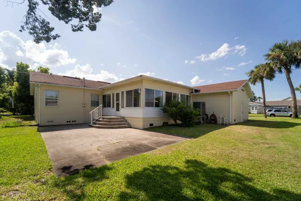an aerial view of residential houses with outdoor space and street view