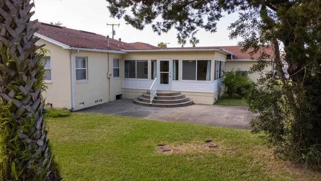an aerial view of residential houses with outdoor space
