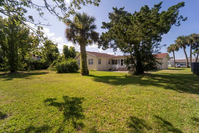 an aerial view of residential house with outdoor space