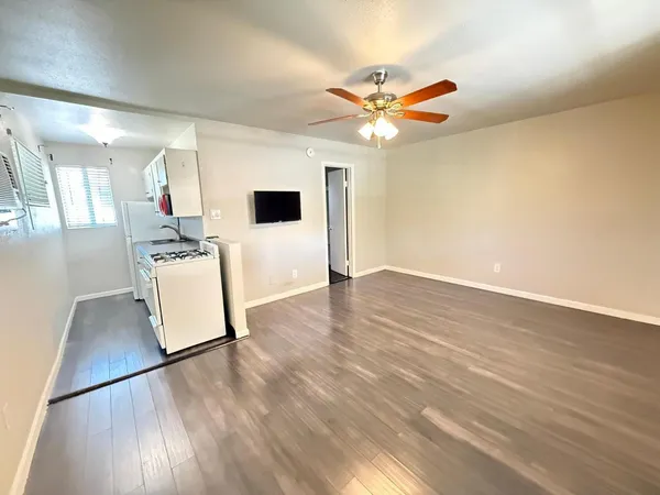 a view of a livingroom with wooden floor