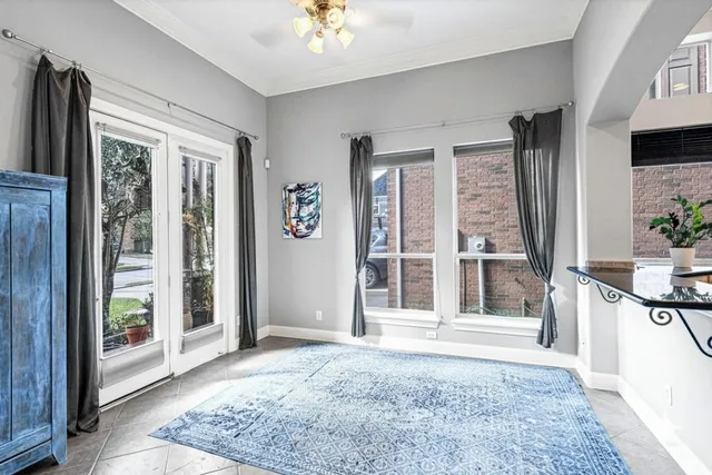 a view of an entryway with wooden floor and livingroom view