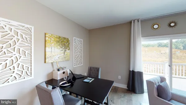 a bedroom with a bed flat screen tv and window