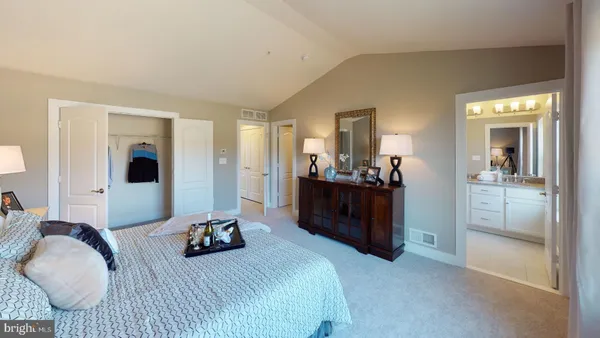a living room with furniture a window and a flat screen tv