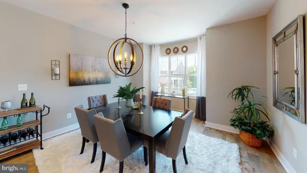 a living room with furniture and a lamp