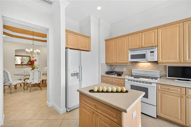 a kitchen with a stove and a microwave