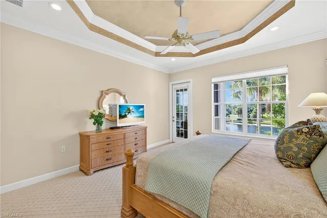 a bedroom with a large bed and a dresser