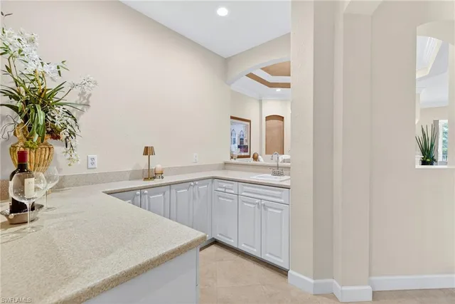 a kitchen with a sink and a refrigerator