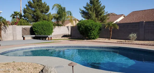a view of a backyard of the house