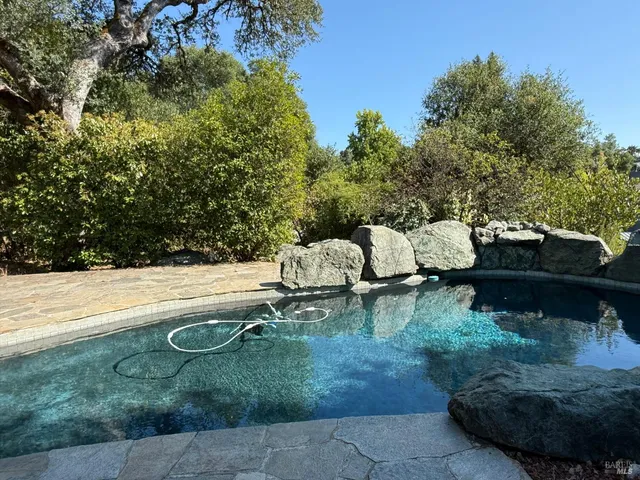 a view of a lake with chairs