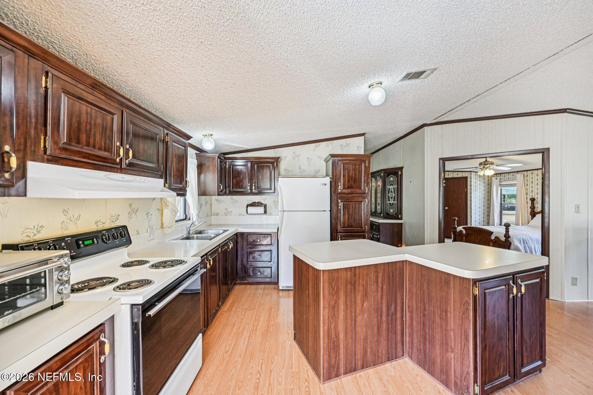 128 Sesame Street Middleburg, FL 32068 - Photo 27 of 66 Large Kitchen with Island