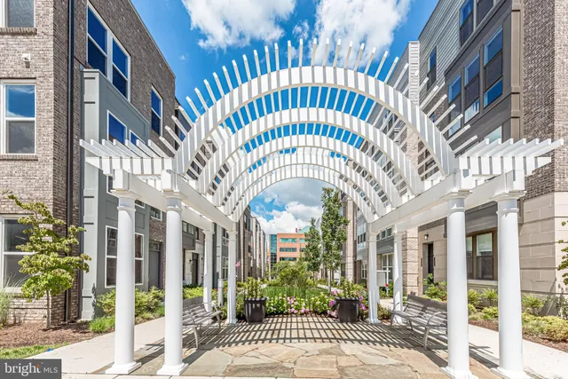 a couple of cars parked in front of brick building